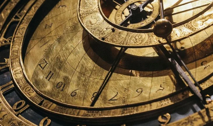 an ancient brass clock